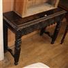 A carved oak side table W.104cm                                                                                                        