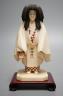 A Japanese ivory figure of a priest, Taisho/early Showa period, signed to a lacquer tablet - 17cm tall                                                                                                                      