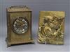 A German brass portrait plaque and a brass mantel clock                                                                                