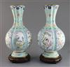 A pair of Chinese Canton enamel vases, early 20th century, H. 35cm, wood stands                                                        