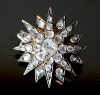 A 19th century French gold and foil backed rose cut diamond set starburst brooch,                                                      