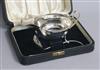 A cased George VI silver sauceboat and sauce ladle, Viners Ltd, Birmingham, 1940, 4 oz.                                                