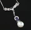 An early 20th century platinum?, sapphire, diamond and baroque pearl set drop pendant, on a later 18ct white gold chain,               