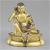 A Sino-Tibetan gilt bronze seated figure of Milarepa, H. 14cm                                                                          