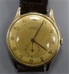 A gentleman's yellow metal Doxa manual wind wrist watch, with subsidiary seconds, on leather strap                                     