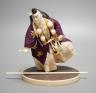 A Japanese ivory figure of a performing Yamabushi warrior monk, Taisho/early Showa period, signed to a lacquer tablet - 17cm tall                                                                                           