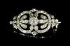 An Edwardian gold, silver and diamond set openwork oval brooch                                                                                                                                                              