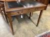 A 1920's oak writing table, width 91cm, depth 60cm, height 76cm                                                                                                                                                             