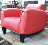 A red leather club armchair, height 70cm, width 87cm, depth 98cm                                                                                                                                                            