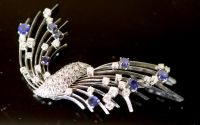 A platinum?, diamond and sapphire set spray brooch,                                                                                    