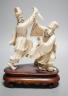 An early 20th century Chinese ivory group of two fighting officials - 21cm tall                                                                                                                                             