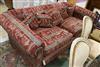 A very large two seater settee, upholstered with an Egyptian taste red, black and cream fabric W.235cm                                 