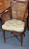 A set of eight Regency style mahogany chairs, with caned backs and sides and green squab seats                                         