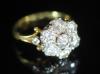 A mid 20th century gold and seven stone diamond cluster ring                                                                                                                                                                