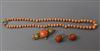 A continental yellow metal, coral and seed pearl brooch and pair of matching earrings and a coral bead necklace.                       