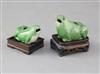 A pair of Chinese green glazed biscuit 'frog' water droppers, 18th century, 6 and 7cm long excluding wood stands                       