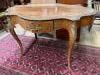 A 19th century French marquetry and kingwood centre table, (having later walnut-veneered top) width 124cm, depth 78cm, height 74cm                                                                                          