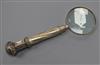 A silver plated handled magnifying glass                                                                                               