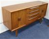 A small McIntosh teak sideboard, fitted four drawers flanked by cupboards W.140cm                                                      