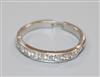 A white metal and nine stone diamond half eternity ring, with extendable shank, size L-Q                                               