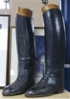 A pair of black leather riding boots and trees                                                                                         