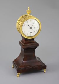 Week's Museum. A Regency gilt brass and mahogany drum case mantel timepiece, height 12.5in.                                            