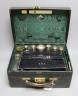 An early 20th century travelling toilet case by Cornhill, London, with seven harlequin silver mounted toilet jars, nail implements and leather stationary case, various dates and makers.                                   