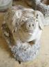 A reconstituted stone seated pig garden ornament, height 38cm                                                                                                                                                               