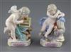 A pair of Meissen figures of Cupids, 19th century, height 11.8cm and 12.5cm                                                            