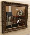 A gilt carved wood and composite wall mirror W.97cm                                                                                    