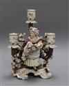 A Sitzendorf porcelain three branch candelabra, decorated with flowers surrounding a girl height 24cm                                  