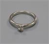 An 18ct white gold and collet set oval solitaire diamond ring, size L.                                                                 