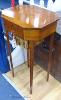 A Sheraton style octagonal satinwood sewing table. W-41, D-33, H-73cm.                                                                                                                                                      