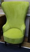 A pair of modern lime velvet high back armchairs                                                                                       