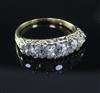 A gold and graduated five stone diamond ring, size M.                                                                                  