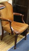 A leather upholstered elbow chair                                                                                                      