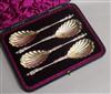 A cased set of four Victorian silver serving spoons with figural terminals, Edward Hutton, London, 1891, 8 oz.                         