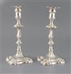 A pair of early George III cast silver candlesticks by Ebenezer Coker, 37.5oz.                                                         