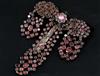 A late 18th century French pinchbeck and shaped cut garnet set drop hair ornament, 10cm.                                               