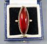 A large yellow metal and amber set marquise shaped dress ring, size N, gross weight 7.6 grams.                                                                                                                              