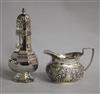 A late Victorian repousse silver cream jug and a later silver sugar caster, 8.5 oz.                                                    