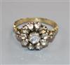 A 19th century yellow metal and rose cut diamond set cluster ring, with carved shank, size L.                                          