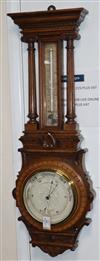 A Victorian carved oak aneroid barometer with thermometer H.92cm                                                                       