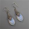 A pair of white metal mounted pear shaped moonstone drop earrings, 32mm.                                                               