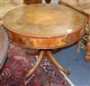 A William Tillman Regency style drum table having leather skiver over four drawers W.92cm                                              