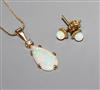 A yellow metal, white opal and diamond set pendant, on a 9ct chain and a pair of 585 and white opal ear studs.                         