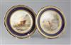 A pair of Royal Worcester cabinet plates, decorated by James Stinton, diameter 9.25in.                                                 