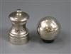 A silver pepper mill and a spherical silver salt                                                                                       