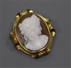 A yellow metal mounted oval cameo brooch, carved with the bust of a lady to sinister, 43mm.                                            