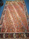 A Caucasian brick red ground Boteh rug 285 x 157cm                                                                                     